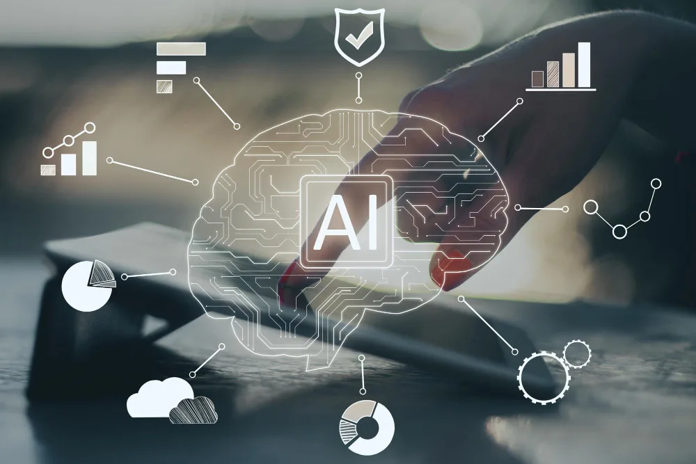 A digital composite image illustrating the concept of artificial intelligence in business, with a transparent, stylized AI brain superimposed over a blurred background featuring a tablet and various graphs and data visualization icons.