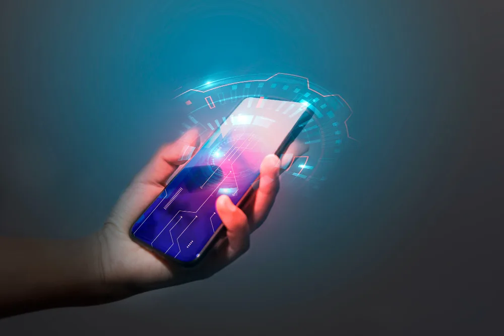 A hand holding a smartphone that projects a futuristic holographic interface, symbolizing the advanced capabilities and interactive nature of generative AI applications.