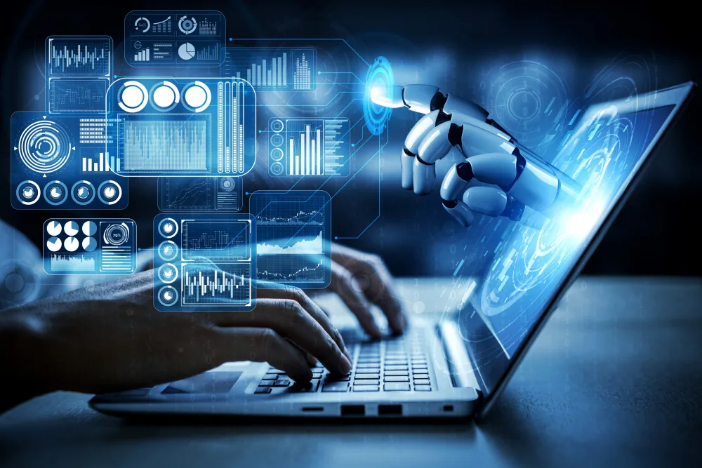 A robot hand extends from a laptop screen, interfacing with various data analytics and business intelligence widgets, illustrating Deloitte's innovative use of AI to interpret complex data for business growth.