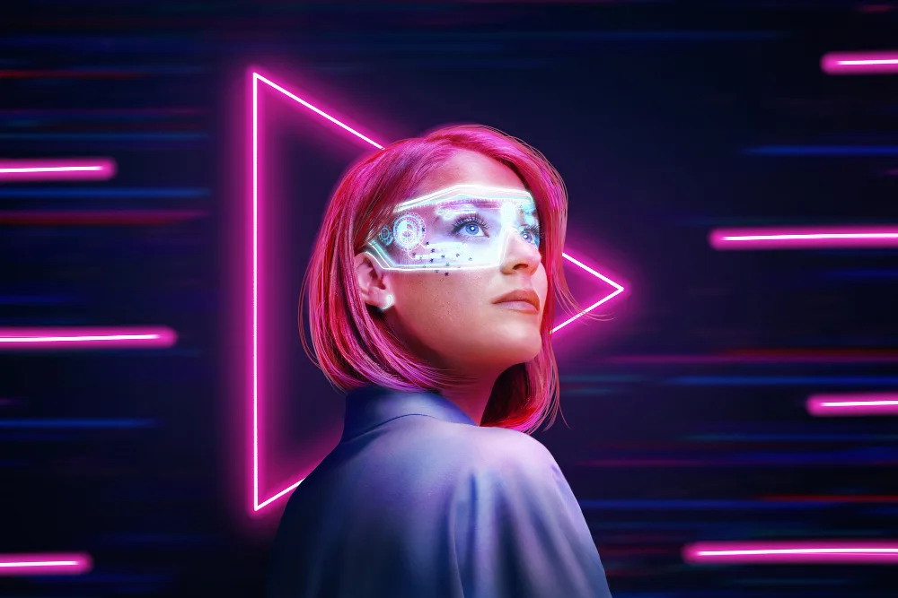 A woman surrounded by neon lights wearing digital AR glasses, representing AI's role in creating lifelike virtual personas in the entertainment industry.