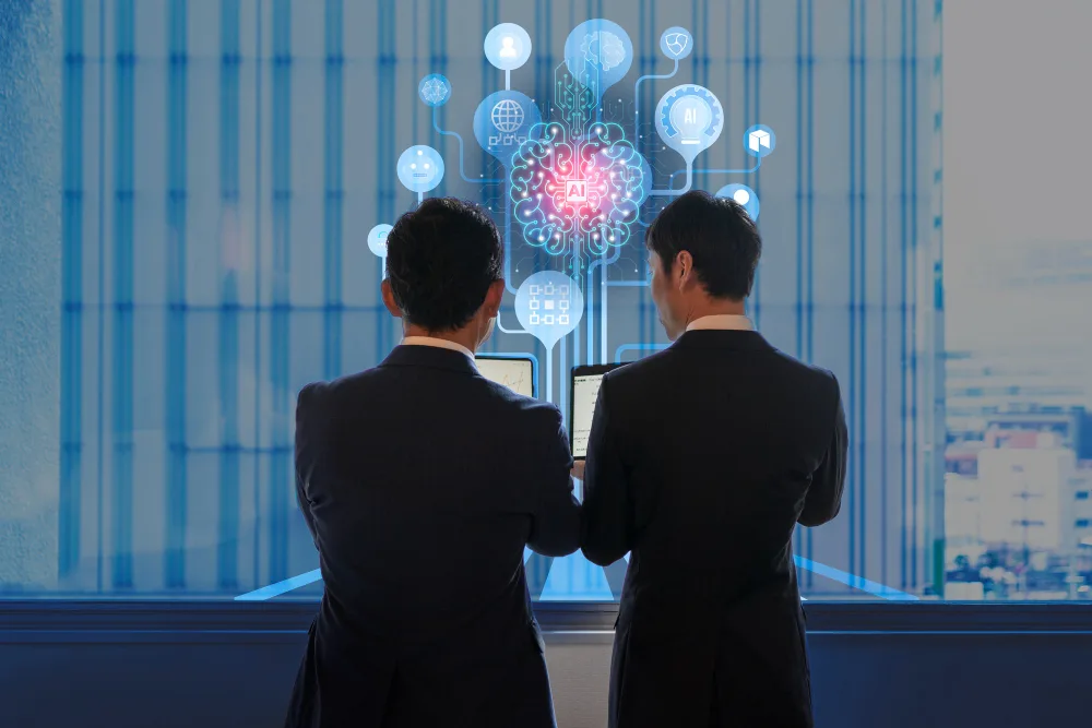 Two businessmen looking at a tablet with AI-brain interface graphics, denoting strategic planning and decision-making powered by generative AI technology.